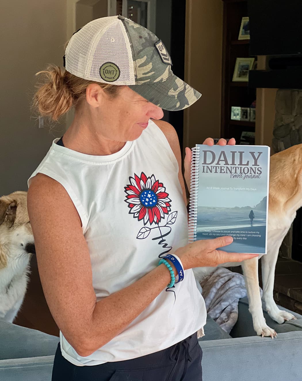 Kelley holding the Daily Intentions Journal
